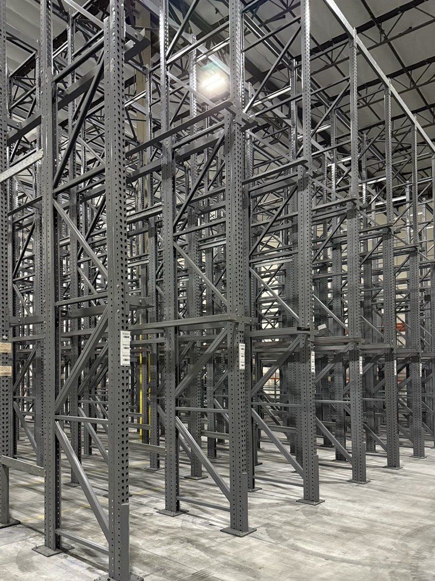 Close view of drive-in rack upright frames and diagonal bracing